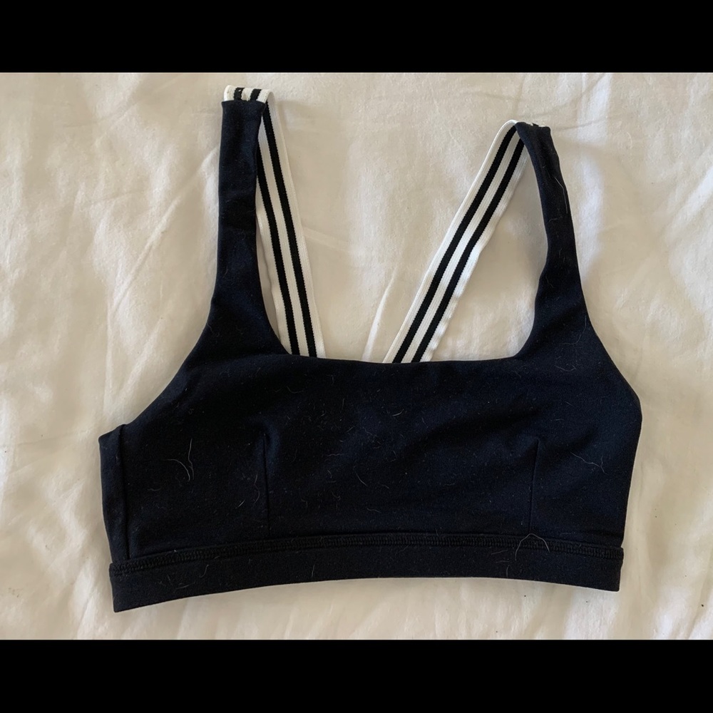 Black sports bra with black and white strap